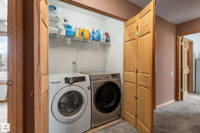 laundry room featuring separate washer and dryer and carpet floors