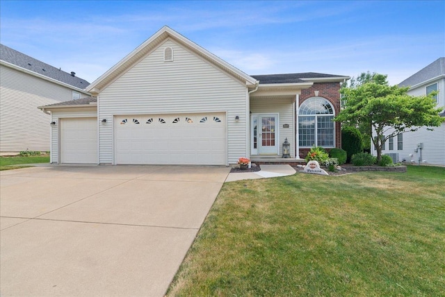 view of front of house with a garage and a front yard