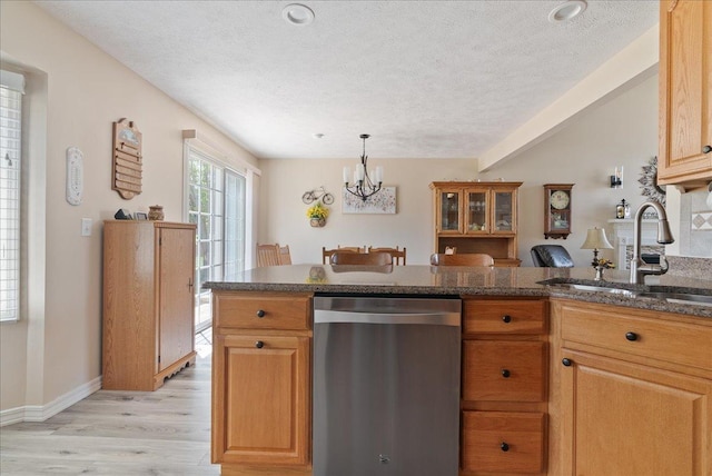 kitchen with sink, a chandelier, a textured ceiling, light wood-type flooring, and stainless steel dishwasher