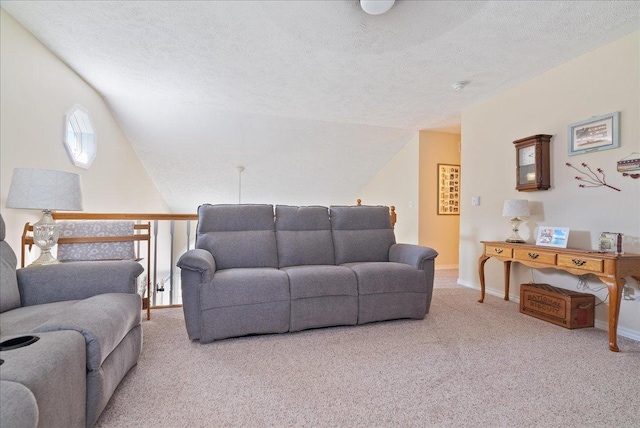 carpeted living room with lofted ceiling and a textured ceiling