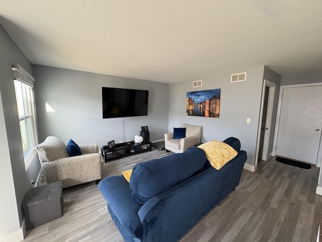 646 Aspen Dr, Romeoville, IL 60446 - living room with wood finished floors, baseboards, and visible vents