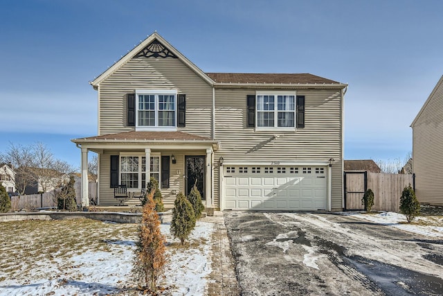 front of property with a garage and a porch