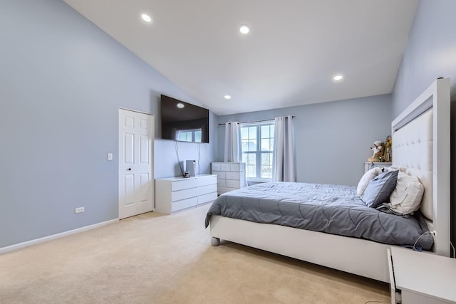 bedroom featuring light carpet and high vaulted ceiling