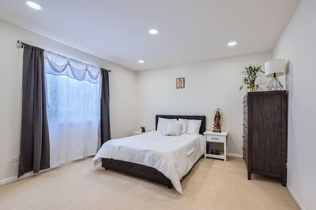 bedroom featuring light colored carpet