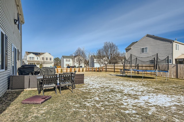 view of yard with a trampoline