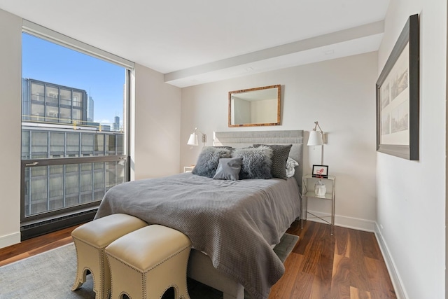 bedroom featuring hardwood / wood-style flooring and floor to ceiling windows