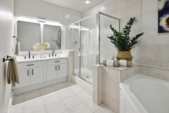 bathroom with tile patterned floors, vanity, and plus walk in shower