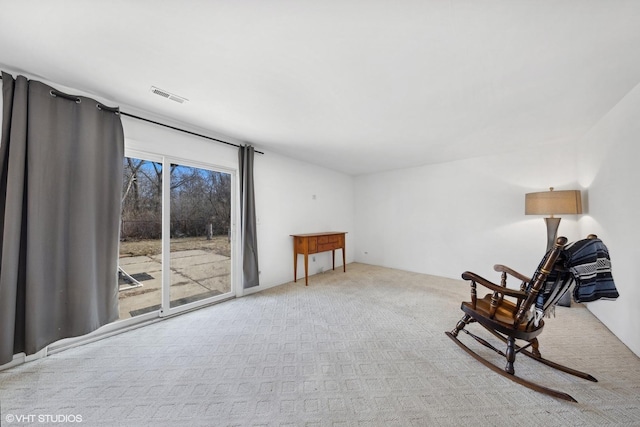 living area featuring light colored carpet