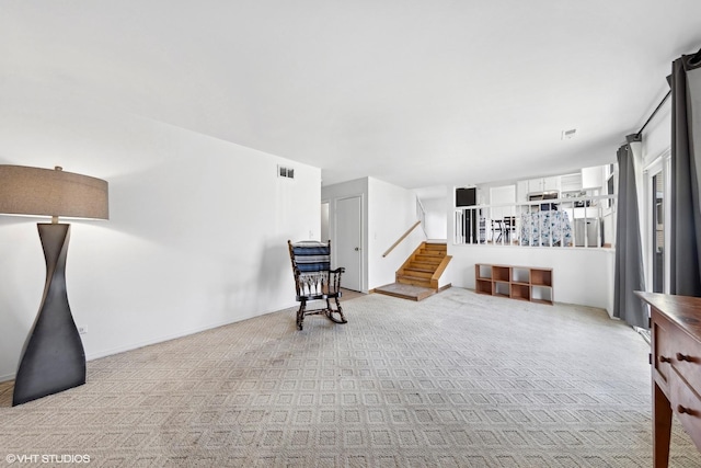 living room with light colored carpet