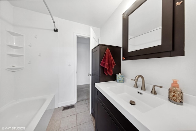 bathroom featuring tile patterned flooring and vanity