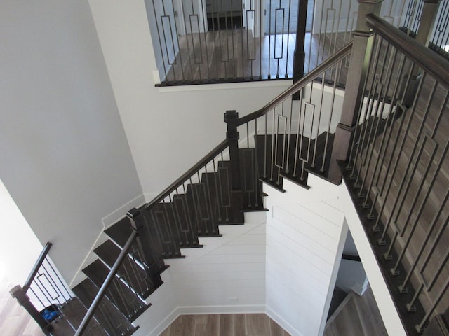 stairway featuring hardwood / wood-style floors