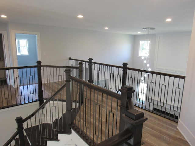 staircase with wood-type flooring