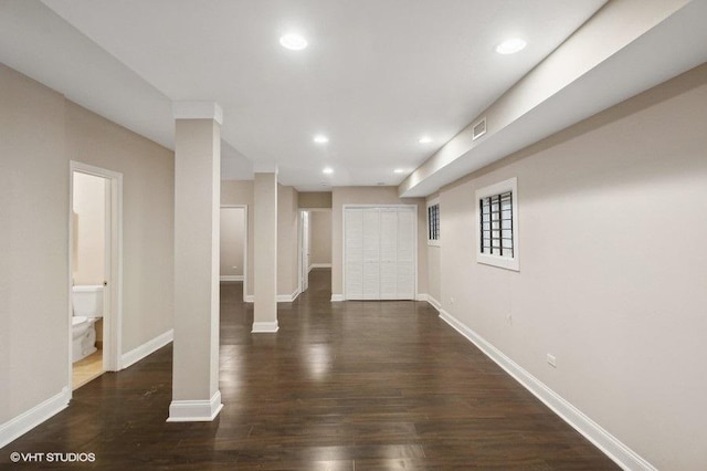 hall with dark hardwood / wood-style flooring