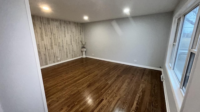 unfurnished room featuring dark hardwood / wood-style flooring