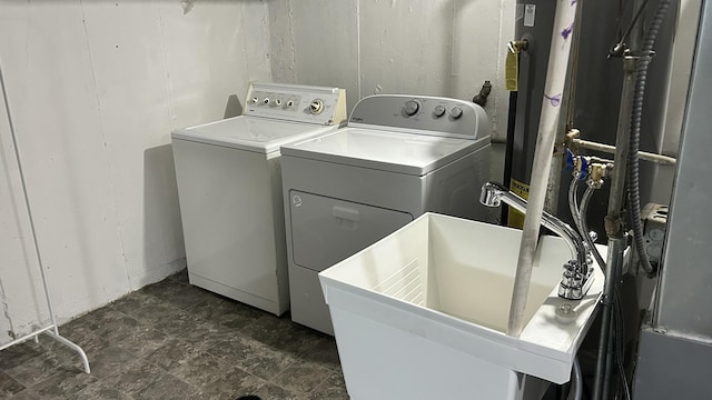 laundry room featuring separate washer and dryer and sink