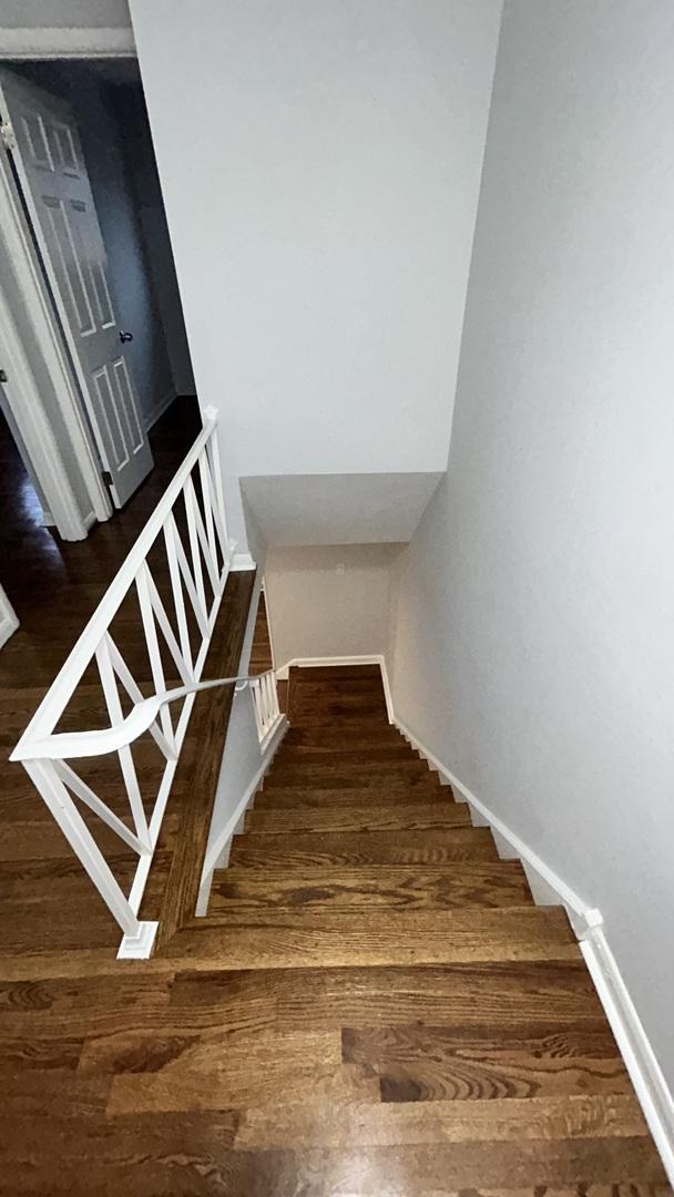 stairs with wood-type flooring