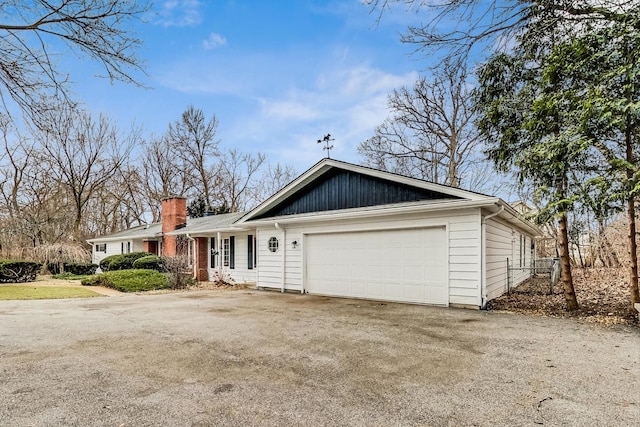 ranch-style home featuring a garage