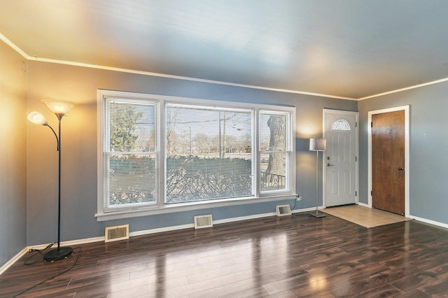 foyer entrance with hardwood / wood-style floors and ornamental molding