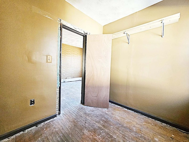 unfurnished room featuring hardwood / wood-style floors