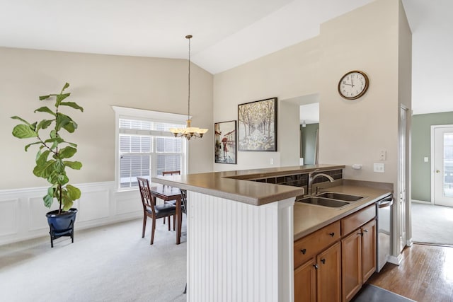 2574 Golf Ridge Cir, Naperville, IL 60563 - kitchen with an inviting chandelier, dishwasher, light carpet, a sink, and decorative light fixtures