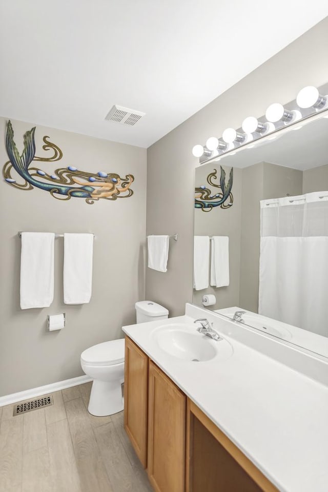 2574 Golf Ridge Cir, Naperville, IL 60563 - bathroom featuring wood finished floors, visible vents, vanity, and toilet