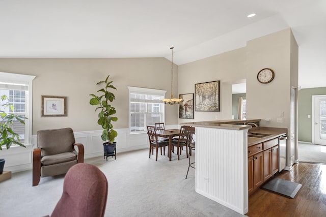 2574 Golf Ridge Cir, Naperville, IL 60563 - kitchen featuring lofted ceiling, a chandelier, a wealth of natural light, and brown cabinets