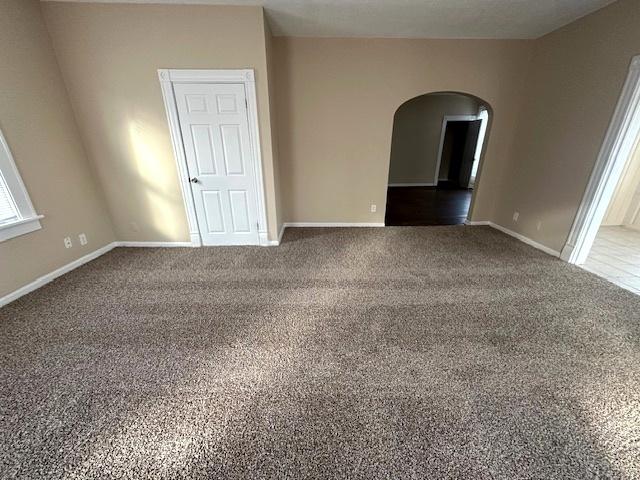 unfurnished room featuring carpet flooring