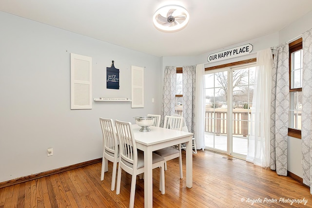 dining area with hardwood / wood-style flooring