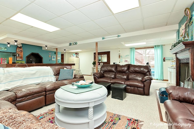 living room featuring a paneled ceiling