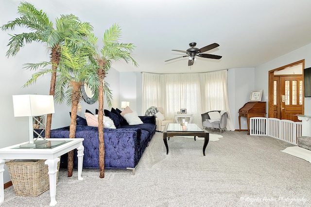 living room featuring ceiling fan and carpet flooring