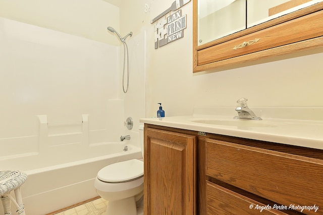 full bathroom featuring vanity, shower / washtub combination, and toilet