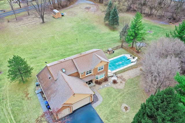 birds eye view of property with a rural view