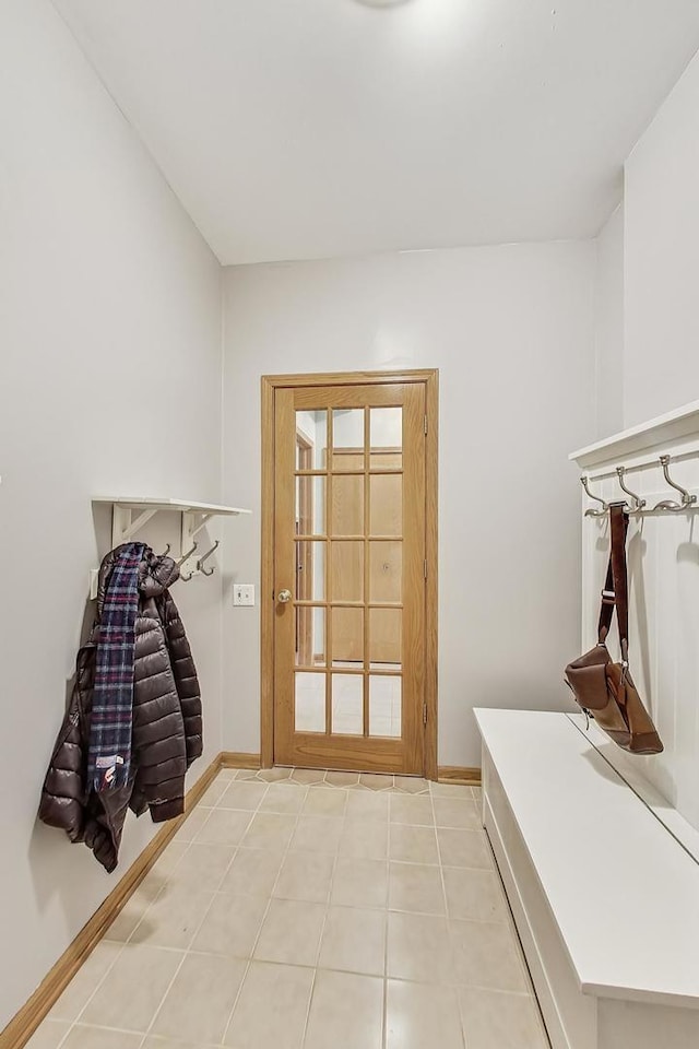 mudroom with light tile patterned floors