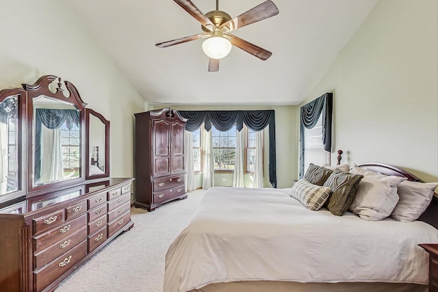 carpeted bedroom featuring high vaulted ceiling and ceiling fan