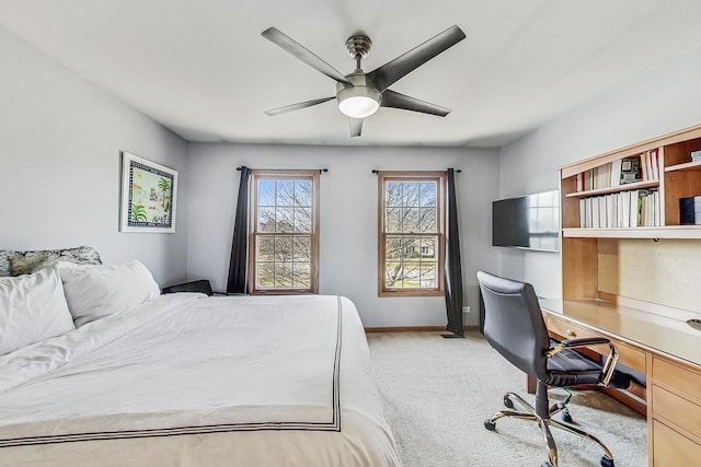 bedroom with light carpet and ceiling fan