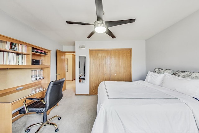 bedroom with light carpet, a closet, and ceiling fan