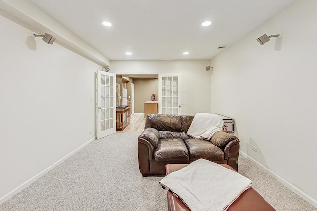 living room featuring carpet and french doors