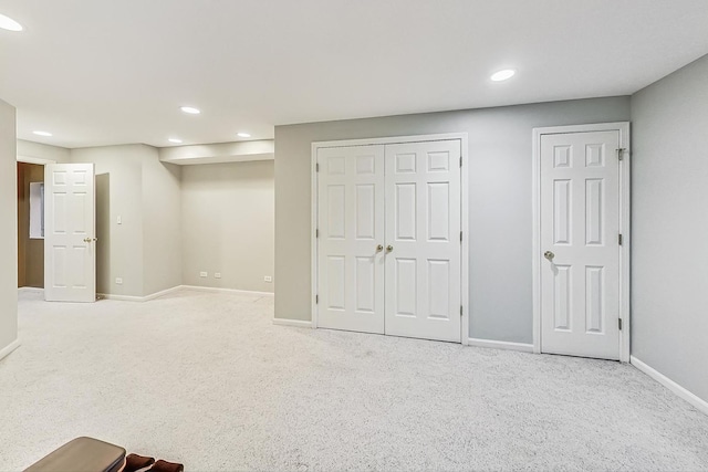 unfurnished bedroom featuring light colored carpet