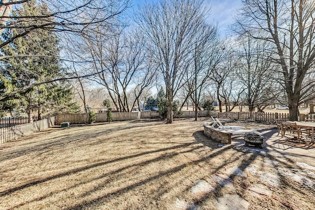 view of yard with an outdoor fire pit