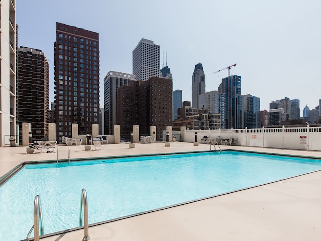 view of swimming pool featuring a patio area