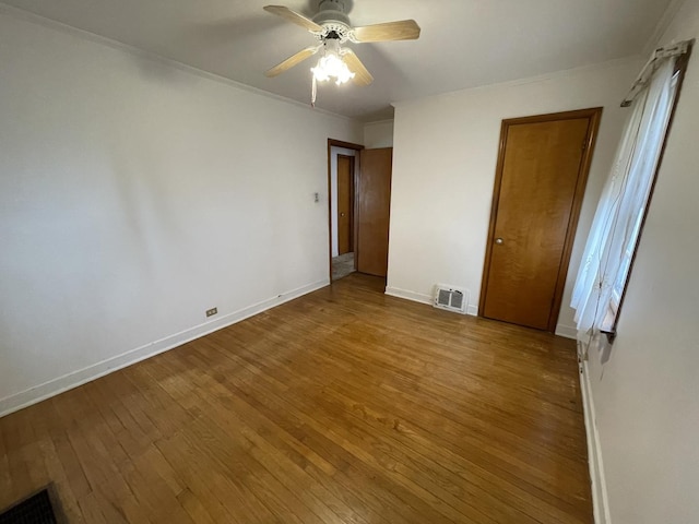 unfurnished bedroom with hardwood / wood-style floors and ceiling fan