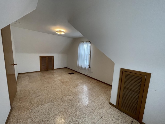 bonus room with vaulted ceiling