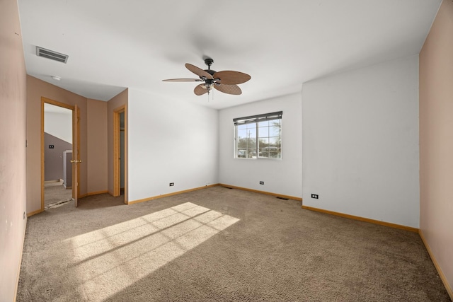 unfurnished bedroom featuring light carpet and ceiling fan