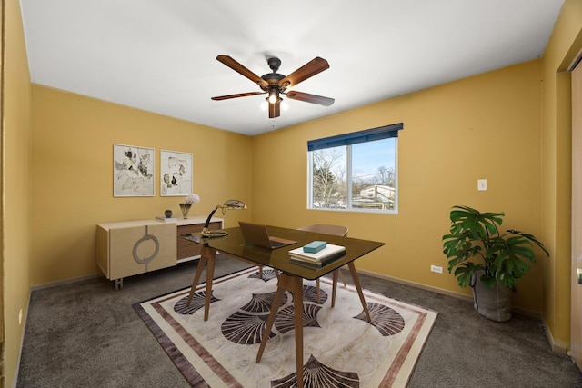 carpeted home office featuring ceiling fan