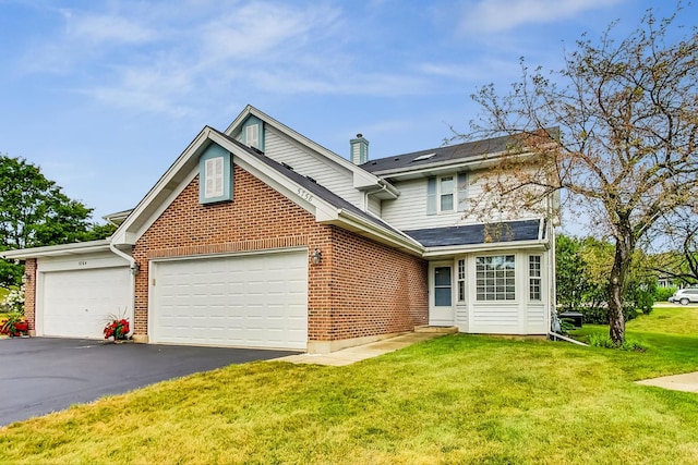 front of property featuring a garage and a front lawn