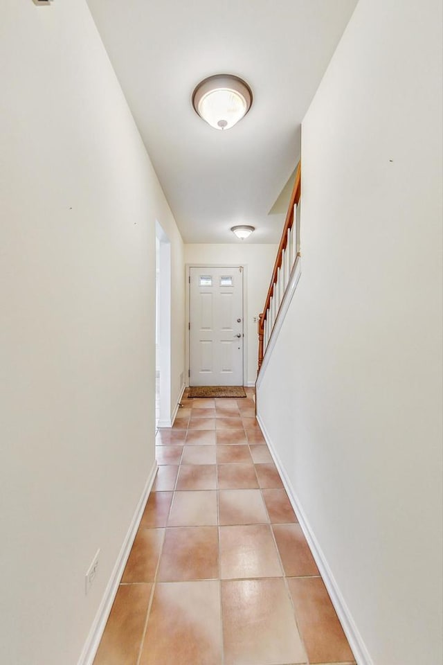 corridor with light tile patterned floors