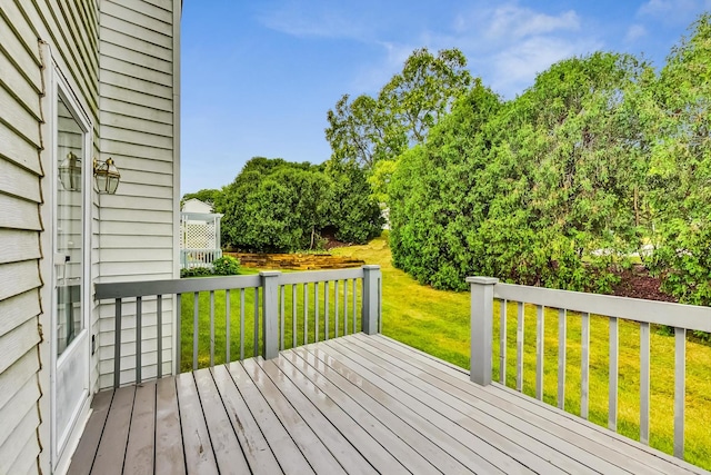 wooden deck with a yard