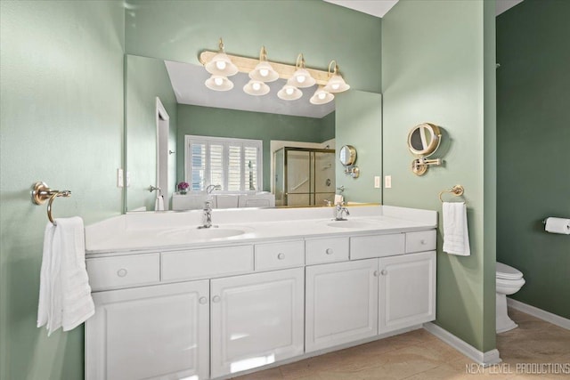 bathroom featuring toilet, vanity, tile patterned floors, and walk in shower