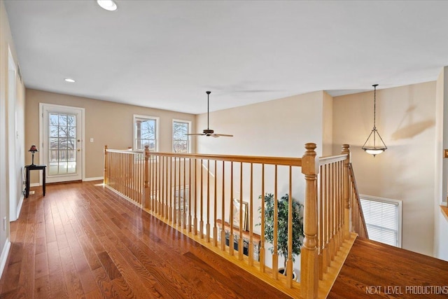 hallway with wood-type flooring