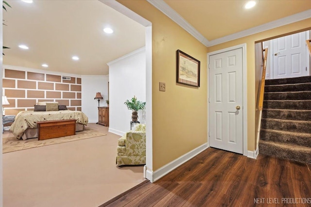 bedroom with dark wood-type flooring and ornamental molding